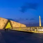 The illuminated exterior and hanging obelisk at twilight during a Cairo half-day GEM tour