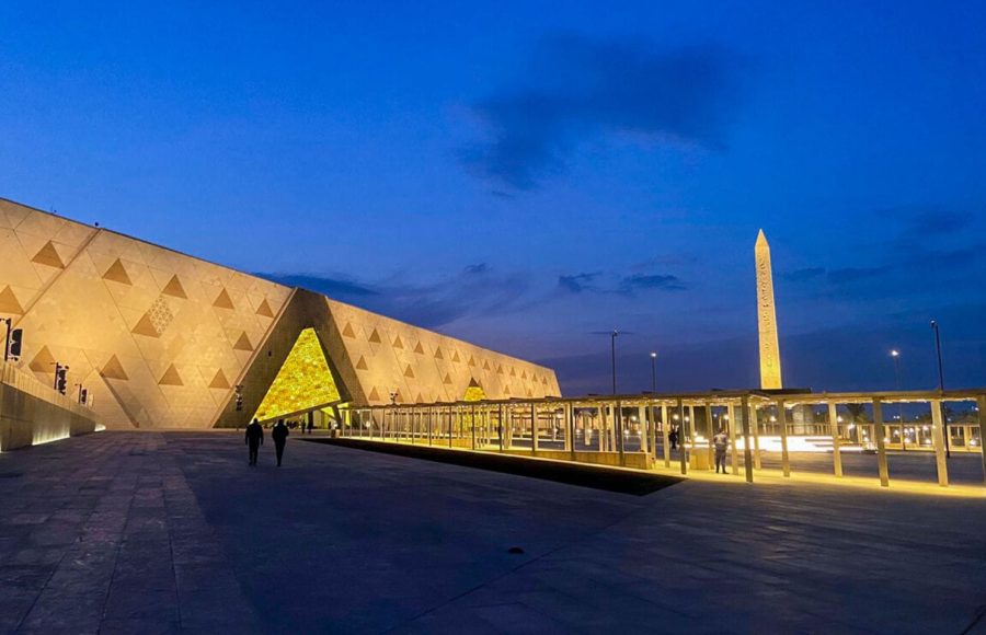 The illuminated exterior and hanging obelisk at twilight during a Cairo half-day GEM tour