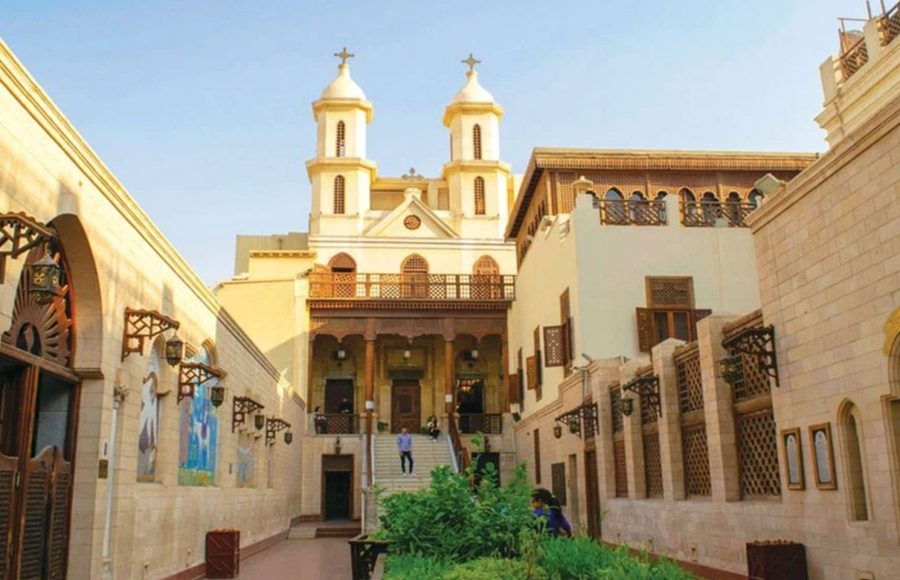 The historic Hanging Church stands beautifully under a clear blue sky during a professional Cairo museum and Old Cairo excursion