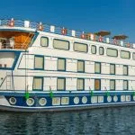 White and blue cruise ship named Chateau Lafayette.