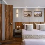 Modern cruise ship bed and en-suite bathroom