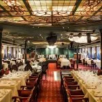 Elegant dining room interior prepared for a spectacular dinner show Cairo experience with stained-glass decor