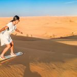 Dubai-dessert-sand-dunes-couple-on-Dubai-desert-safari-United-Arab-Emirates-woman-vacation-in-Dubai