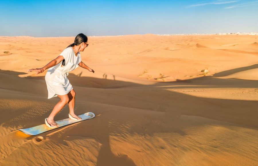 Dubai-dessert-sand-dunes-couple-on-Dubai-desert-safari-United-Arab-Emirates-woman-vacation-in-Dubai