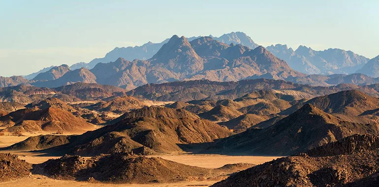 Panoramic View Of The Rugged, Layered Brown And Reddish Mountains Of The Eastern Desert, Egypt.