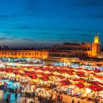 Evening-Djemaa-El-Fna-Square-with-Koutoubia-Mosque-Marrakech-Morocco