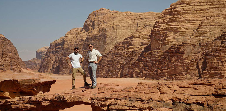 Father and son tourists in Jordan The Wadi Rum a rocky desert landscape in southern Jordan