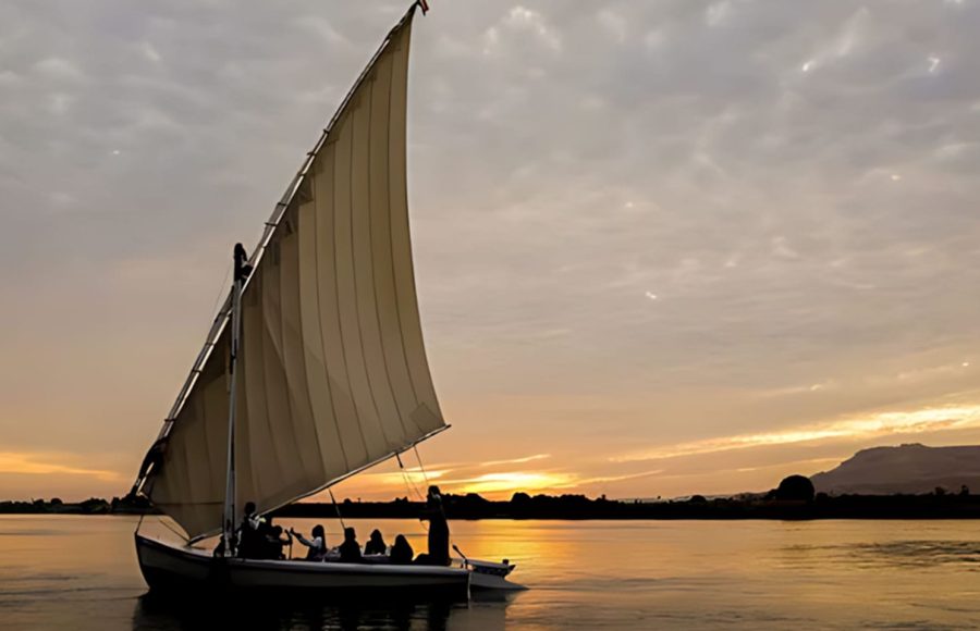 A group sails into the sunset ahead of their scheduled Nile cruise with a traditional music