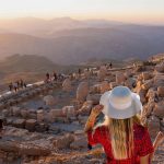 Girl-watch-sunset-on-top-of-the-Nemrut-Mountain-in-Adiyaman-Turkey