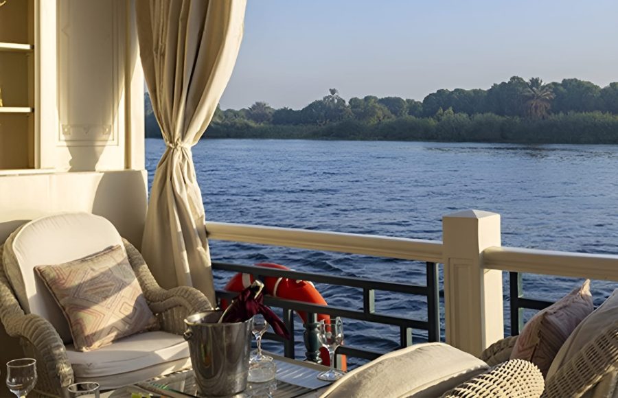 Wicker armchair on a boat deck overlooking the Nile.