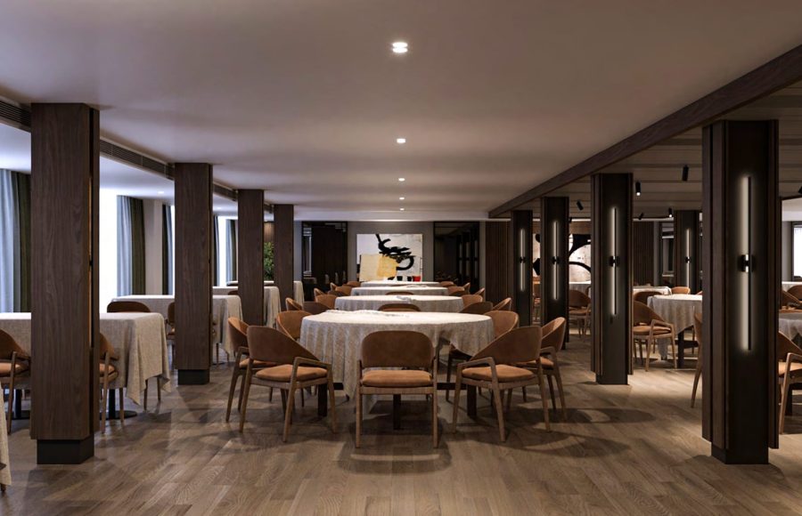 A spacious and elegant main dining room on the Hansa Spirit Nile cruise ship. The room features multiple round tables covered with light tablecloths and surrounded by warm, brown leather chairs. Dark wood columns frame the space, and the floor is polished wood. Abstract art hangs on a back wall, and soft lighting illuminates the room.