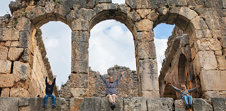 Happy family in Roman bath of ancient Greek city Tlos Famous historical site In Antalya region 1