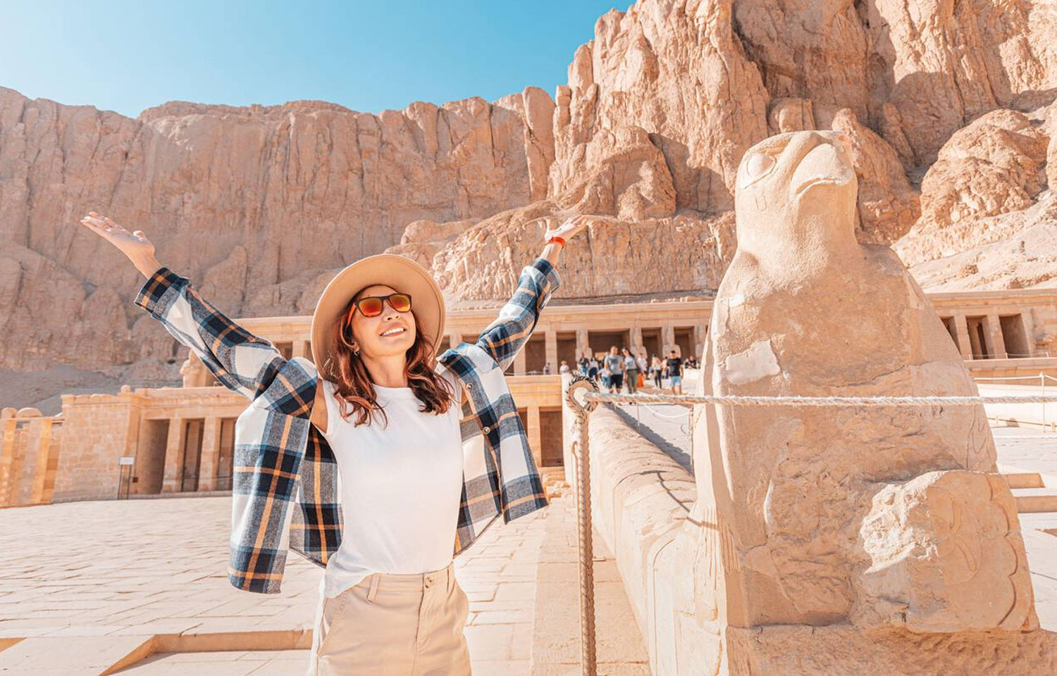 Happy Woman Explores The Ruins Of The Ancient Egyptian Hatshepsut Temple In The Heritage City Of