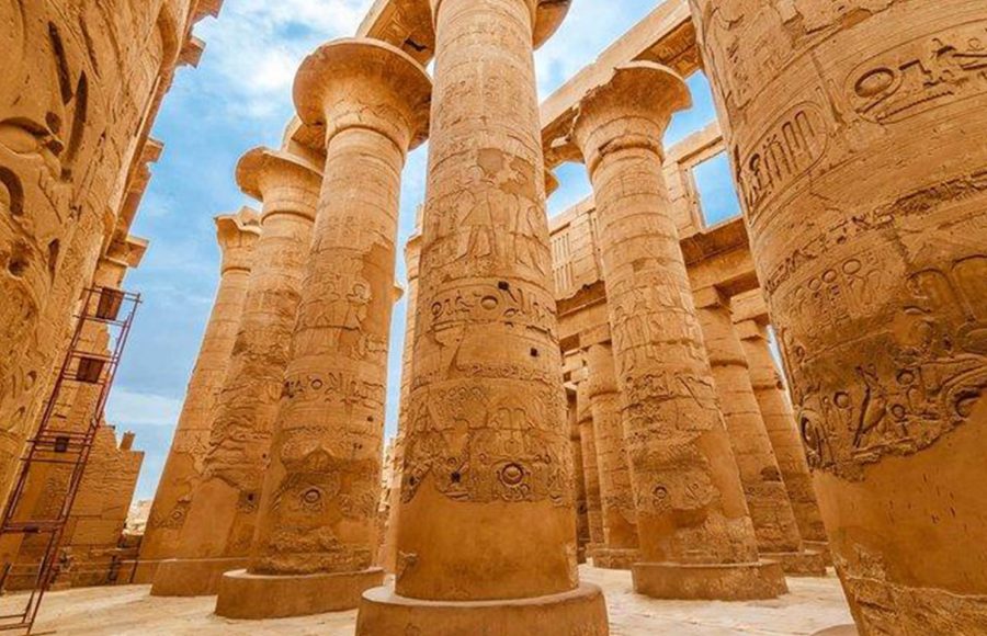 Close-up view of the giant, carved columns in the Hypostyle Hall of Karnak Temple, Luxor, Egypt.