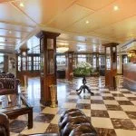 The elegant and spacious lobby on the La Traviata Nile Cruise features comfortable seating and a front desk.