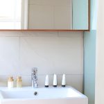 Modern white bathroom sink with luxury toiletries on a Nile cruise.