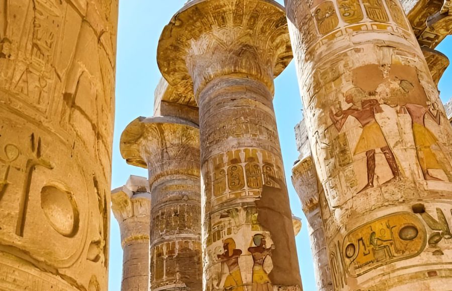 Tall, painted columns in the Hypostyle Hall of Karnak Temple.