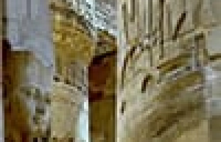 Ancient Egyptian columns and statues with hieroglyphs.