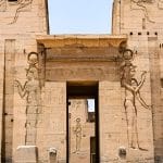 Pylon entrance of the Philae Temple with large carved deities