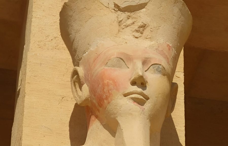 Close-up of a statue head of Queen Hatshepsut with faint color remnants
