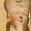 Close-up of a statue head of Queen Hatshepsut with faint color remnants