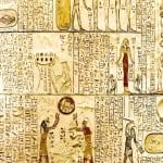 Ancient Egyptian hieroglyphs and carvings on a wall