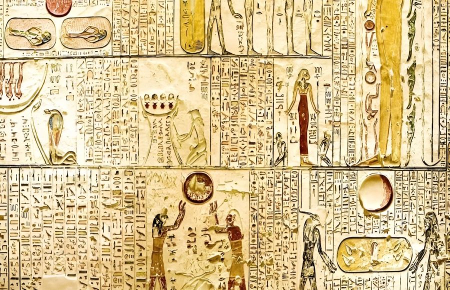 Ancient Egyptian hieroglyphs and carvings on a wall