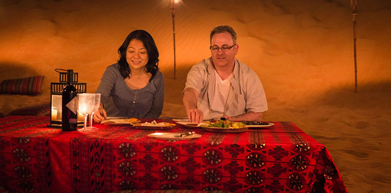 Luxury Travel Mature Couple Eating Dinner Desert Camp Dubai UAE