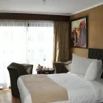 A cabin on the MS Al Nabilatan with a window view.