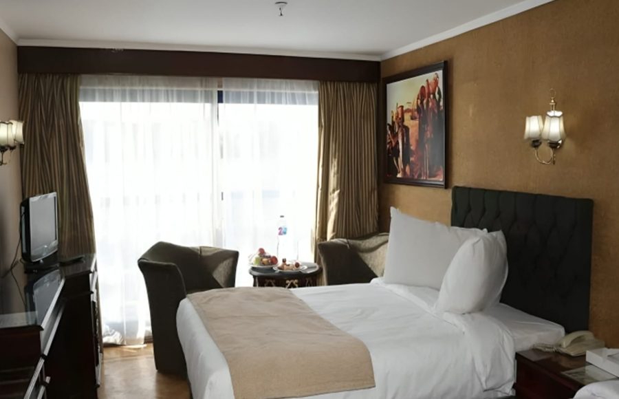 A cabin on the MS Al Nabilatan with a window view.