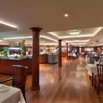 Large interior dining hall with a central buffet station.