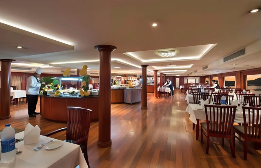 Large interior dining hall with a central buffet station.