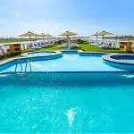 Cruise ship sundeck with pool and loungers