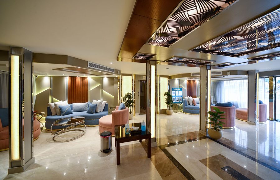 The elegant and luxurious lobby aboard the MS Nile Treasure Cruise, featuring modern seating, polished marble floors, and sophisticated decorative lighting.
