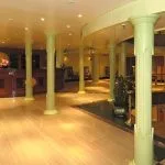 The elegant wooden reception desk and lobby area of the MS Quest Nile Cruise with classic pillars.