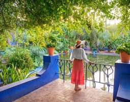 Majorelle-Gardens-in-Marrakesh-Morocco A tourist walks towards the grand entrance of the Temple of Edfu, a well-preserved ancient temple with carved stone facades.