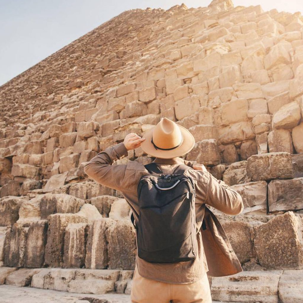 Man Tourist Walks Background Of Pyramids In Giza Cairo Egypt