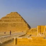 Visitors exploring the vast desert landscape during a Memphis Saqqara Dahshur tour from airport