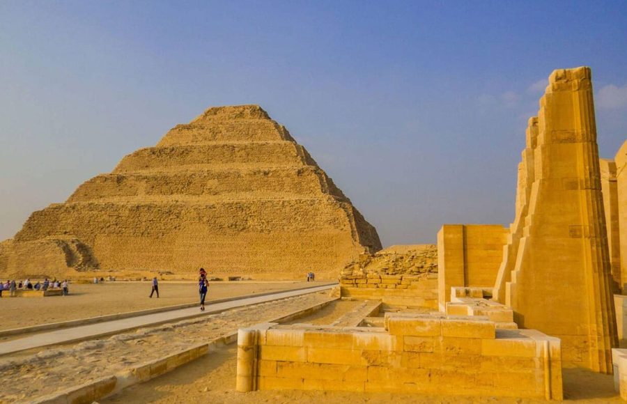 Visitors exploring the vast desert landscape during a Memphis Saqqara Dahshur tour from airport