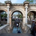Men-sit-at-the-stairs-which-lead-through-The-Gate-of-Hadrian-built-in-honour-of-the-Roman-emperor-Hadrian-in-Kaleici-at-Antalya-in-Turkey