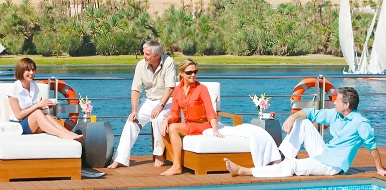 Tourists Relaxing On A Cruise Ship Deck On The Nile River.