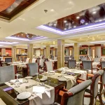 The elegant dining room and restaurant of a Nile cruise ship, a key amenity during your Egypt cruise tours Abu Simbel.