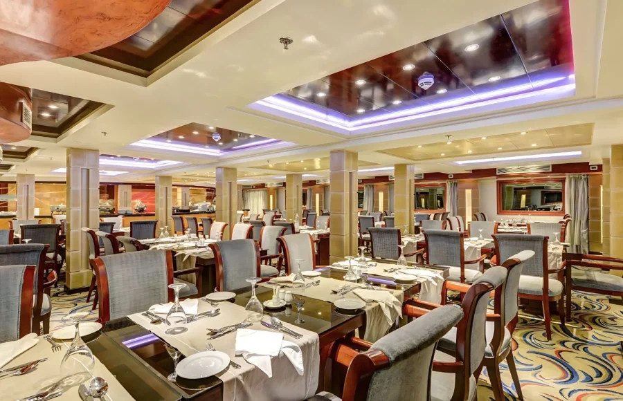 The elegant dining room and restaurant of a Nile cruise ship, a key amenity during your Egypt cruise tours Abu Simbel.