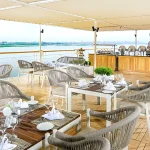 A dining area on the sun deck, an amenity included in the Nile Cruise with Red Sea Stay.