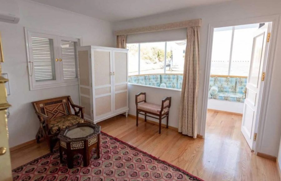 Terrace suite with seating area and balcony on a Nile cruise boat.