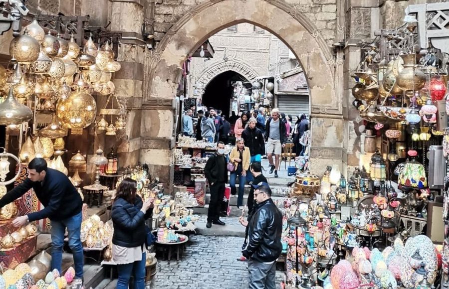 An enchanting display of glowing brass lanterns at a bustling market during a professional Egyptian Museum Cairo tour