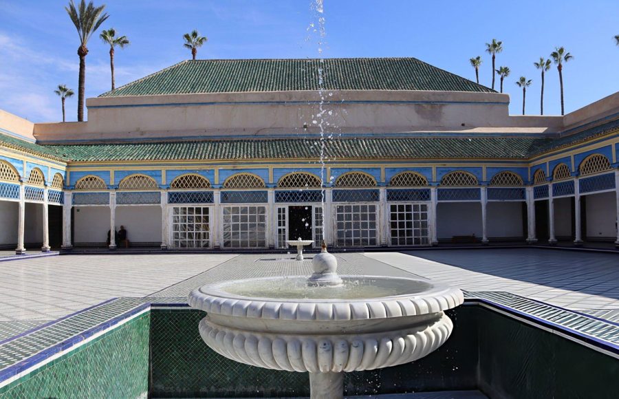 Ornate-fountain-surrounded-by-traditional-Moroccan-architecture-in-the-courtyard-of-Bahia-Palace-in-Marrakech-Morocco