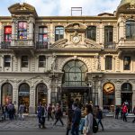 People-walking-in-front-of-Cicek-Passage-or-Cite-de-Pera-a-famous-historic-passage-on-Istiklal-Avenue-Istanbul