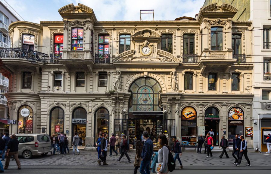 People-walking-in-front-of-Cicek-Passage-or-Cite-de-Pera-a-famous-historic-passage-on-Istiklal-Avenue-Istanbul