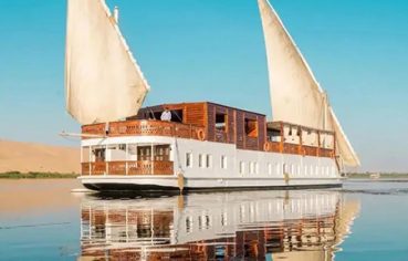 A traditional Egyptian Dahabiya sailing boat on the Nile riverThe Royal Cleopatra Dahabiya cruise ship on the Nile River, Egypt.